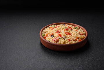 Delicious couscous porridge with cubes of grilled vegetables with salt and spices