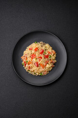 Delicious couscous porridge with cubes of grilled vegetables with salt and spices
