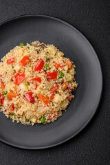 Delicious couscous porridge with cubes of grilled vegetables with salt and spices