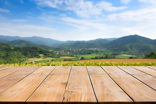 Wooden plank floor table and empty front, and beautiful mountains with sunlight in the early morning Refreshing atmosphere