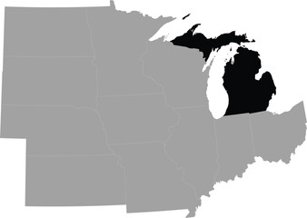 Black Map of US federal state of Michigan within the gray map of Midwest region of United states of America