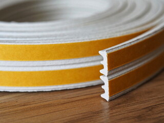 Door and window rubber seal strip. Self adhesive rubber gasket. Sealing tape for windows and doors in a roll. Rubber sealant for windows and doors  