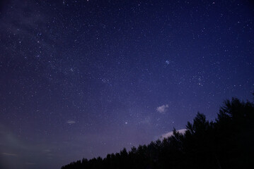 Fototapeta na wymiar Purple night sky full of stars as background
