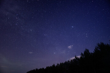 Purple night sky full of stars as background