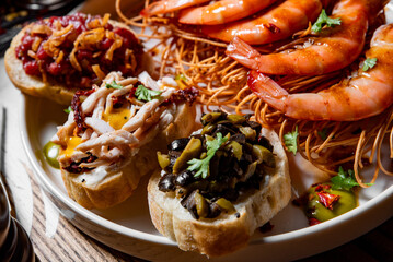 set tapas and shrimp on plate