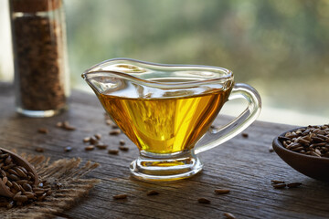 Flax seed oil with linseeds on a table