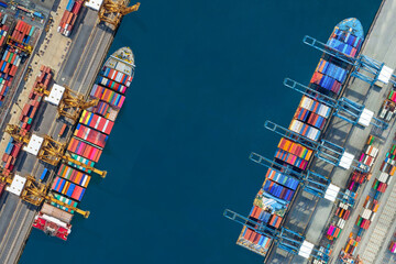 Industrial import-export port prepare to load containers. Aerial top view container ship in export and import global business and logistic. Global transportation and logistic business.