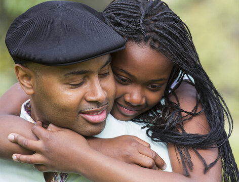 Daughter Hugging Her Father; Edmonton, Alberta, Canada