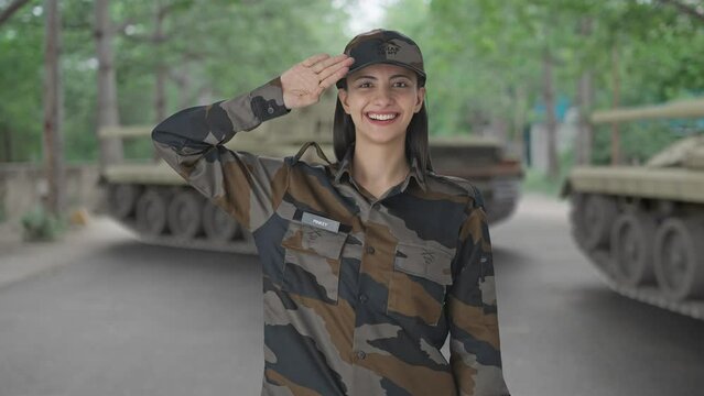 Happy Indian woman army officer saluting