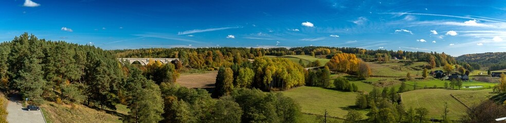 Fototapeta na wymiar Panorama.View of the Stanczyki bridges on an autumn ,sunny day.