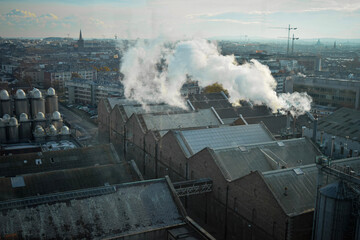Naklejka premium panorama of the city industrial part of dublin Ireland with fog and moody weather smoke