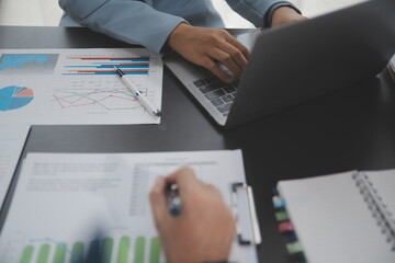 Financial Business team present. Business man hands hold documents with financial statistic stock photo, discussion, and analysis report data the charts and graphs. Finance Financial concept