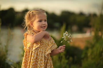 luminous eyes and joyful smile of a little girl holding daisies exemplify the wonder and curiosity...