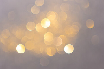 bokeh of the golden flakes-glittering gold particles. defocus effect for backdrop or background.