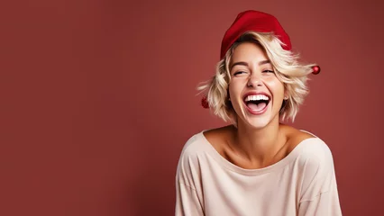 Fotobehang Blonde woman smile in santa claus red hat, Christmas background design © pariketan