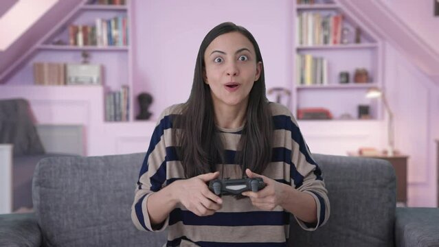 Happy Indian girl wins a video game