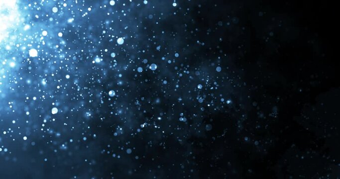 Blue-colored underwater dust particles moving under rim light tiny source 4K Stock footage.Particles luxury premium smooth bokeh background.Glittering award show dust, tail wave shining fairy dust.
