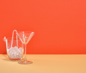 Glass ice bucket and wine or champagne glass. Space for text. Bright experiences and relaxation with friends.