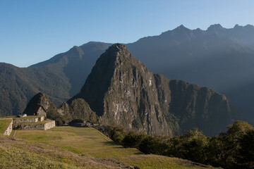 View of the mountains at sunrise at Machupicchu with a blue sky on a clear day, Sacred Valley, Peru. 