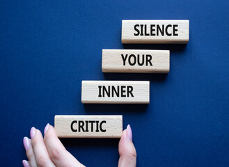 Silence your inner critic symbol. Wooden blocks with words Silence your inner critic. Beautiful...