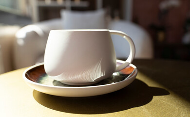 Creative workspace of a blogger. Laptop computer on wooden table in loft style corner office with brick walls and big windows. Designer's table concept. Close up, copy space, background.
