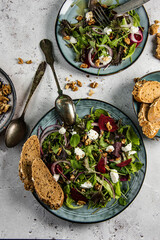 Fresh green salad, ruccola, different lettuce, cottage cheese or ,feta cheese, beetroot and seasoning with wholegrain bread
