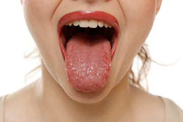 Close up of a woman mouth sticking tongue on a white background