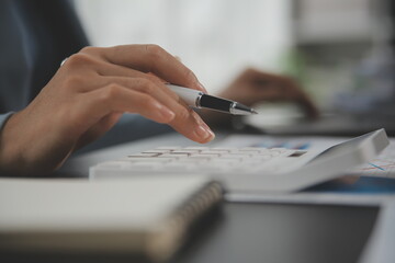 Financial Business team present. Business man hands hold documents with financial statistic stock photo, discussion, and analysis report data the charts and graphs. Finance Financial concept