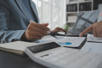 Naklejka premium Financial Business team present. Business man hands hold documents with financial statistic stock photo, discussion, and analysis report data the charts and graphs. Finance Financial concept