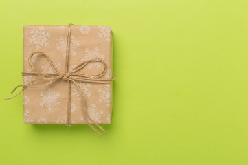 Craft christmas gift boxes on color background, top view