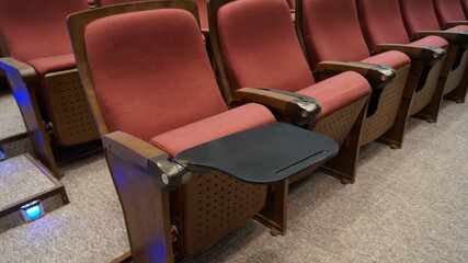 Seats of the auditorium. Concert hall equipment, spectator seats without people.