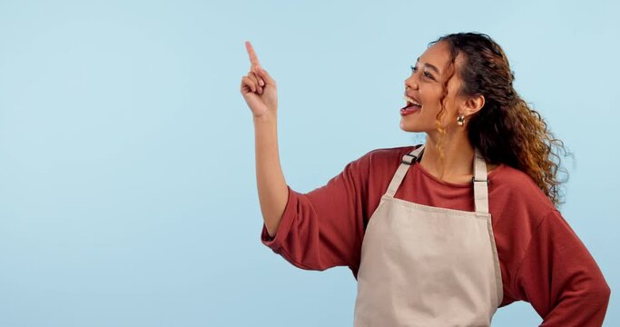 Studio woman, happy barista and point at cafeteria logo design, coffee shop promotion or cafe mockup space. Diner waitress, hospitality presentation portrait or server notification on blue background