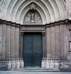 Front view of an ancient Gothic door arcade Cathedral