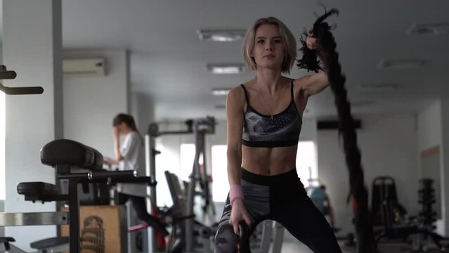 Squad fitness girl gym bodybuilding, Weightlifting girl gym fitness training, Sports woman training. Young woman making incline with fitness equipment front of mirror on gym, Beautiful girl doing 