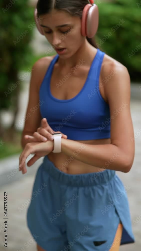 Sticker A young woman in sports clothing is getting her body ready with warm-up exercises before her run.