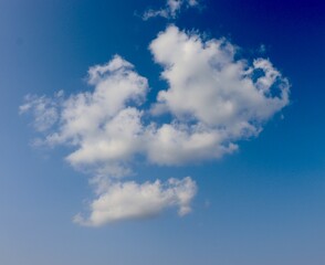 The white clouds in the blue sky.