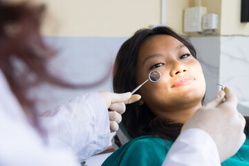 Smiling Asian Patient in a Dentist Office in Kathmandu, Nepal