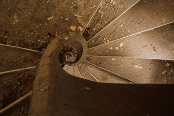 Wooden Snail Staircase in abandoned castle view direct into the eye
