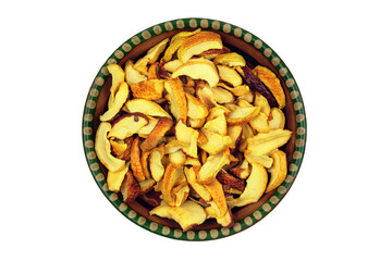 Dried apples in a clay vintage plate isolated on a white background. Vegetarian organic foods. Country style. Top view.