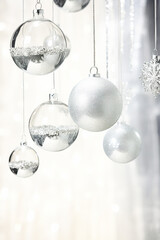 Silver Christmas Ornaments Hanging from Ceiling