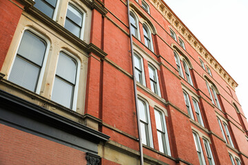 brick building with arched windows, symbolizing stability and growth in the business and mortgage...