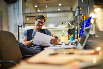 Young male architect working in a modern business office