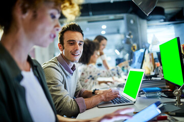 Young diverse of group people working on a laptop in a startup company office