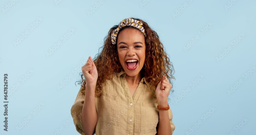 Wall mural Face, dance and excited woman in celebration in studio isolated on a blue background mockup space. Portrait, happy person moving with energy and smile at music party for success, winner and good news