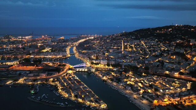 Sete french maritime city by night aerial shot 