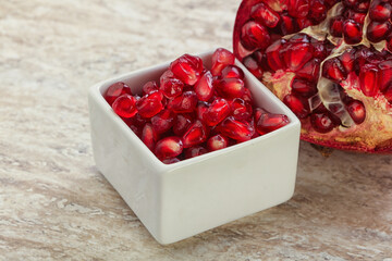 Ripe red Pomegranate seeds in the bowl