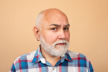 Fototapeta premium Portrait of senior man in studio. Grey hair senior model. Old male portrait.