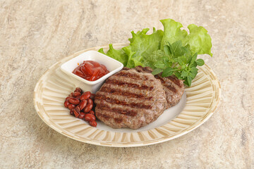 Grilled beef burger cutlet with sauce