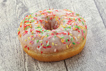 Sweet glazed vanilla donut with icing