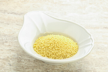 Raw couscous in the bowl